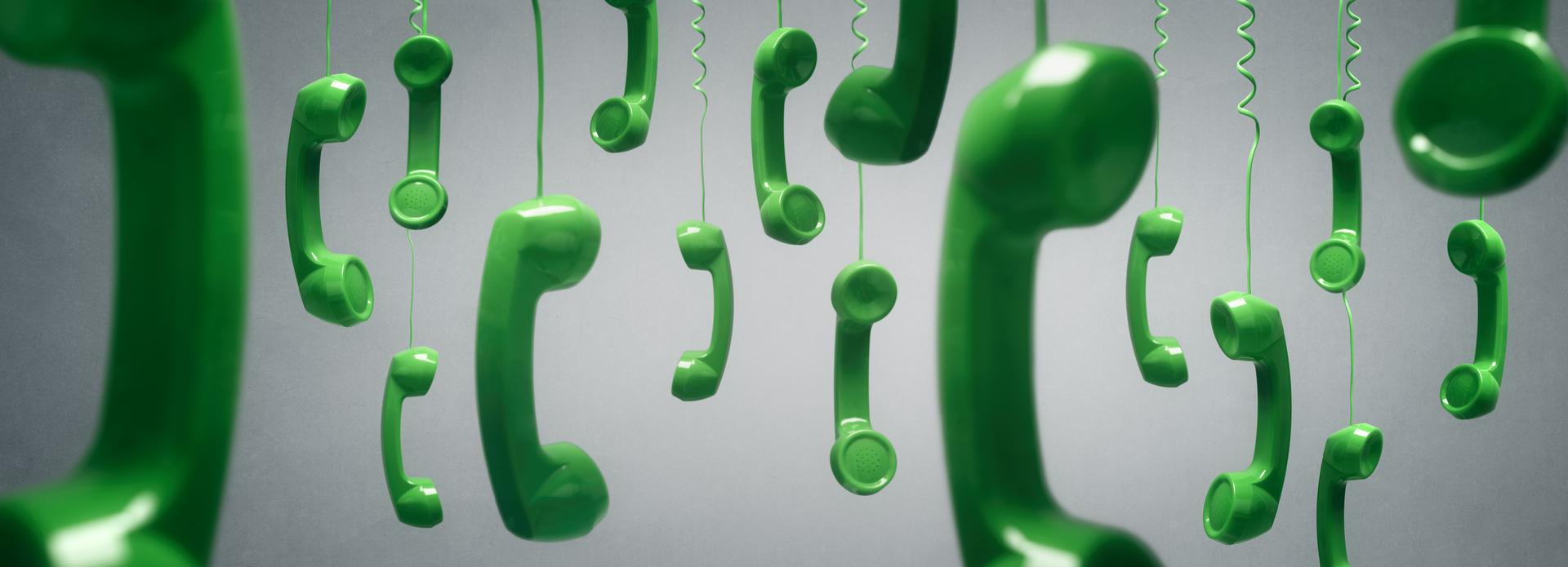 Green telephone receiver hanging background concept for on the phone, customer service, on hold or contact us
